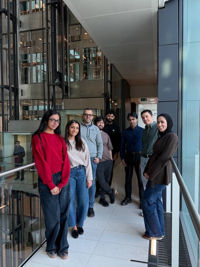 Members of the Ayan team on the office walkway